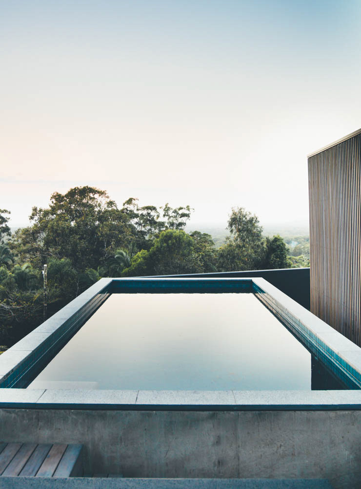 The kitchen, living and dining open onto the northeast garden and pool.